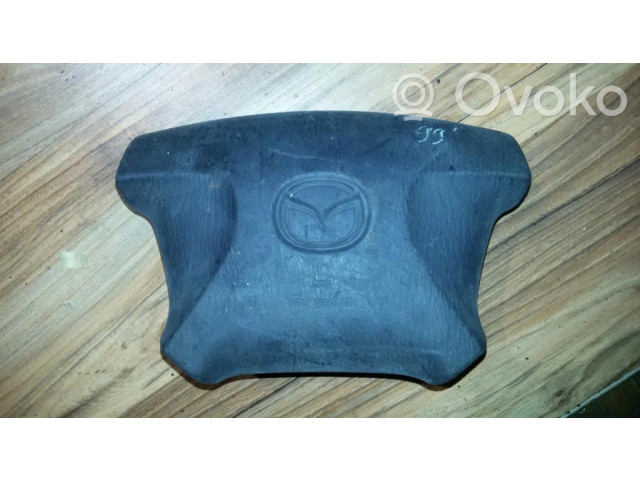 Подушка безопасности водителя T93059A   Mazda 323