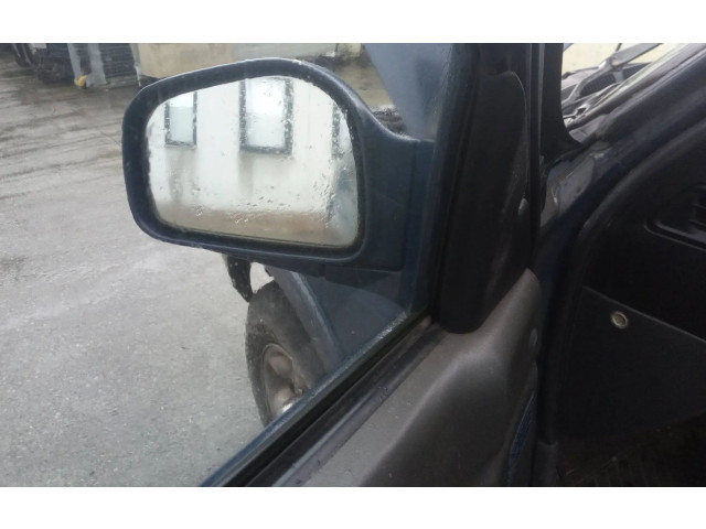 Zpětné zrcátko  SsangYong Musso 1998    