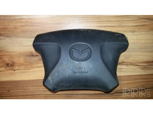 Подушка безопасности водителя T93059A   Mazda 323