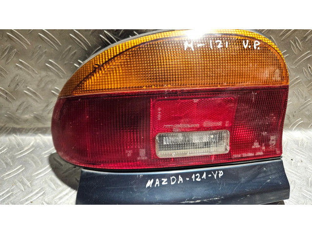 Задний фонарь левый 22061364, 3309505L    Mazda 121   1992-1995 года