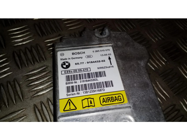 Блок подушек безопасности 0285010070, 65779184432   BMW X1 E84